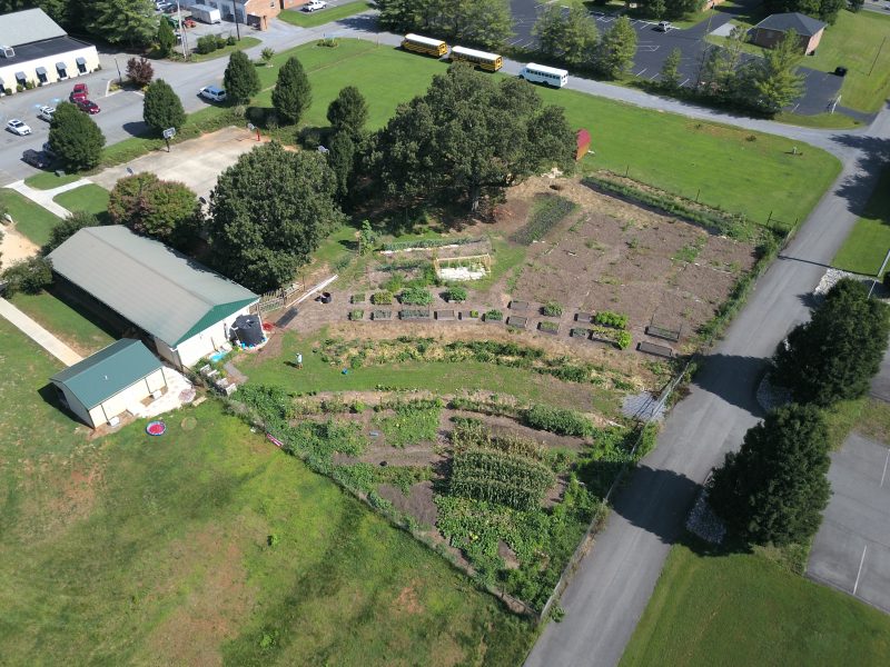 aerial view of a large garden next to a building