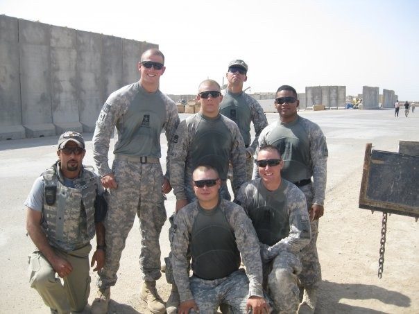 Davin Combs, second from left, stand with a group of Army personnel in uniform at FOB Garry Owen in Amarrah, Iraq.