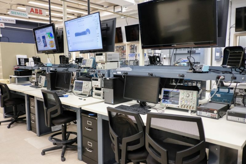 CPES Lab in Blacksburg, VA. Computer screens and desks in a line