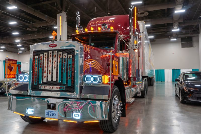 A hokie-themed semi-truck park inside of a convention hall